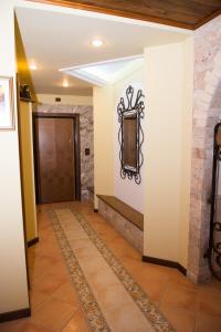 a hallway with a door and a tile floor at DB Apartment in Tirana