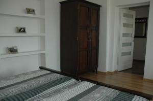 Posteľ alebo postele v izbe v ubytovaní Apartament Rodzinny S7