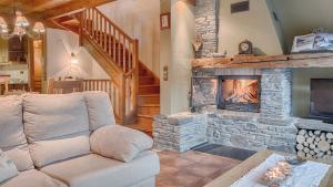 a living room with a couch and a fireplace at Casa Irissa in Vielha