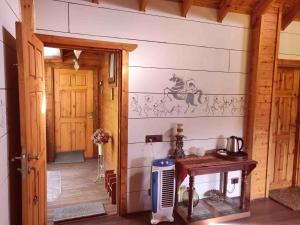 a room with a wall with a horse stencil on it at Avaas - Bed & Breakfast in Nainital