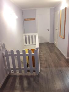 a baby room with a crib and a hallway at Family Appartment in Sankt Englmar