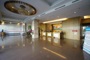 a lobby of a building with a lobbyasteryasteryasteryasteryasteryasteryasteryastery at Hai Yue Hotel in Magong