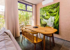 a dining room with a wooden table and chairs at De Haas Living @ Die Laan 2 in Stellenbosch