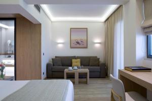 Ένα ή περισσότερα κρεβάτια σε δωμάτιο στο Golden Age Athens Hotel