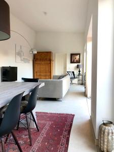 a bedroom with a bed and a table and chairs at Werderapartment, FeWo und DZ in Werder