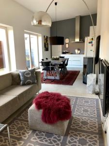 a living room with a couch and a dining room at Werderapartment, FeWo und DZ in Werder +20 photos