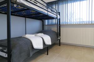 Postel nebo postele na pokoji v ubytování Hotel Ikast