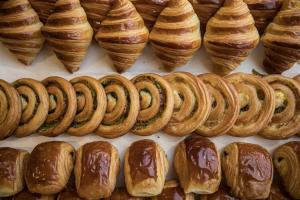 a bunch of croissants and pastries on a display at Le Manoir aux Quat'Saisons, A Belmond Hotel, Oxfordshire in Great Milton