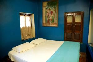 Postel nebo postele na pokoji v ubytování Ram Bhawan Residency