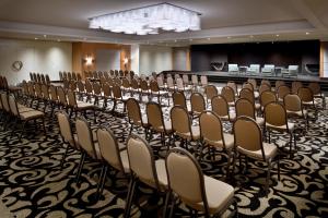 a row of chairs in a room with a stage at Mövenpick Hotel Beirut in Beirut +211 photos