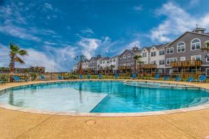 a large swimming pool in the middle of a resort at Pathway 14820 in Padre Island