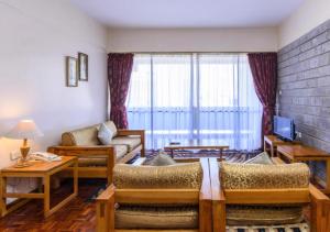 TV a/nebo společenská místnost v ubytování Chester Hotel and Suites Nairobi, City Centre CBD