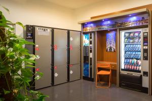 a locker room with lockers and a drink machine at htop BCN City #htopEnjoy in Barcelona