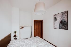 Posteľ alebo postele v izbe v ubytovaní Apartament ST2