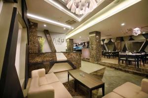 TV a/nebo společenská místnost v ubytování Hotel Neo - Kuta, Jelantik