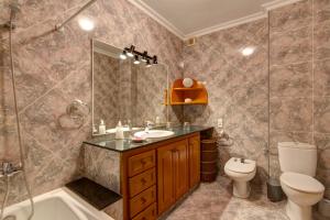 a bathroom with a sink and a toilet and a shower at Holiday Home Casa Nova by Mauter Villas in Ciutadella +43 photos