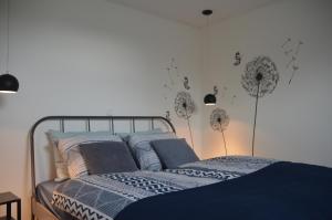 Postel nebo postele na pokoji v ubytování B&B de Pottenbakkershoeve