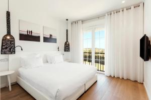 Кровать или кровати в номере Ama Islantilla Resort