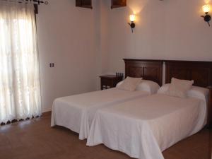 Postel nebo postele na pokoji v ubytování Hotel Casa Beletri