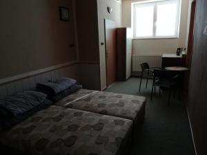 Rúm í herbergi á Ubytování Kozov