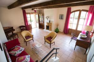 a living room with a red couch and chairs at BIOAGRITURISMO la Collina Casa Romeo in Larciano