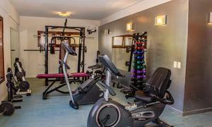 a gym with several exercise bikes in a room at Hotel Savoia Ostende in Ostende
