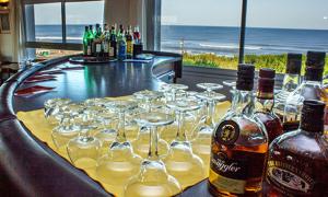 a bar with a bunch of wine glasses on a counter at Hotel Savoia Ostende in Ostende +20 photos