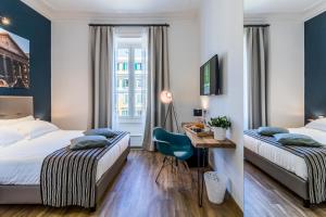 A bed or beds in a room at OTTO Rooms & Photogallery