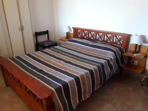 Een bed of bedden in een kamer bij Cabañas Mi Capricho