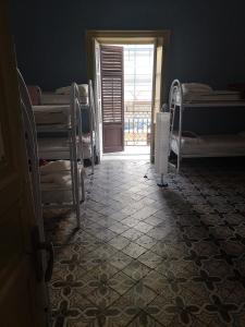 Postel nebo postele na pokoji v ubytování Sunshine Hostel Palermo
