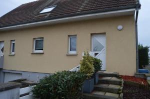 a house with a staircase in front of it at Au Pays de la Potasse in Ungersheim