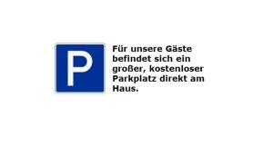 a parking sign with the words put universe elastic behind theoth elim cheaper than at Ferienwohnung Ranch in Meckenbeuren