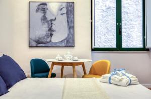 A bed or beds in a room at Mythos Holidays