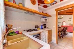 A kitchen or kitchenette at Villa Es Coste Rafal By SunVillas Mallorca