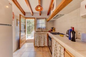 A kitchen or kitchenette at Villa Es Coste Rafal By SunVillas Mallorca