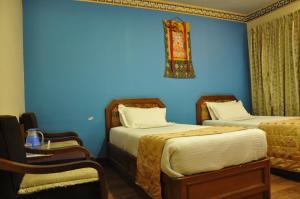 Voodi või voodid majutusasutuse Tibet Guest House toas