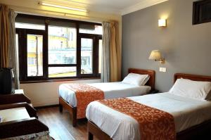 Voodi või voodid majutusasutuse Tibet Guest House toas
