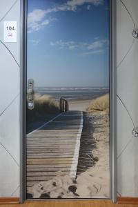 a walkway with a view of the ocean at Stern Hotel in Leipzig