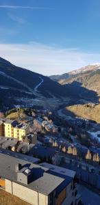 an aerial view of a city with a river and buildings at Soldeu Paradis Soldeu in Soldeu