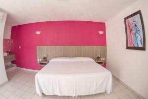 Hotel Santa Cruz Juchitanにあるベッド