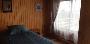 Postel nebo postele na pokoji v ubytování Cabaña Quiquel, Dalcahue, Chiloe