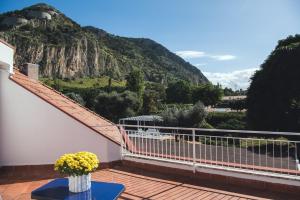 a balcony with a view of a mountain at Il Giardino di Venere in Mondello