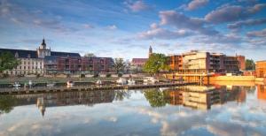 a view of a city with a river and buildings at Apartamenty Via Marina in Wrocław