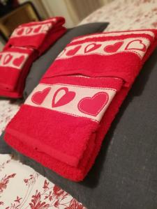 two red towels on a table with a knife at La Ludocanda in Turin