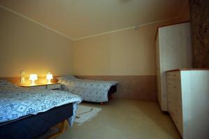 Postel nebo postele na pokoji v ubytování Piibutopsu Holiday House
