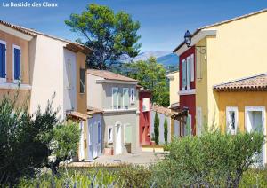 a row of houses in a small town at Lagrange Vacances Domaine de Fayence in Fayence