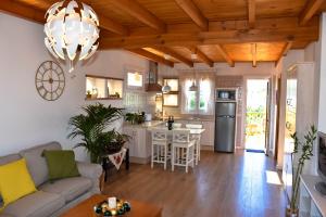 a kitchen and living room with a couch and a table at Chalet Las Viñas 2 in Icod de los Vinos