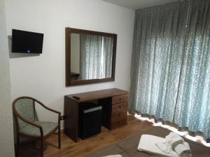 TV a/nebo společenská místnost v ubytování Hotel I Larici