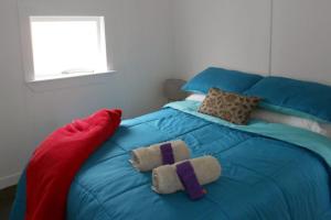 Postel nebo postele na pokoji v ubytování Whanga Butcher Shop