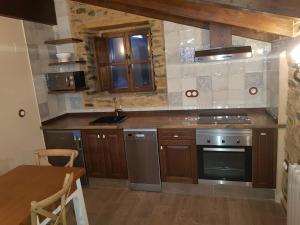 Kuchyň nebo kuchyňský kout v ubytování Apartamentos Rurales Casa Carmen + 31 fotografií